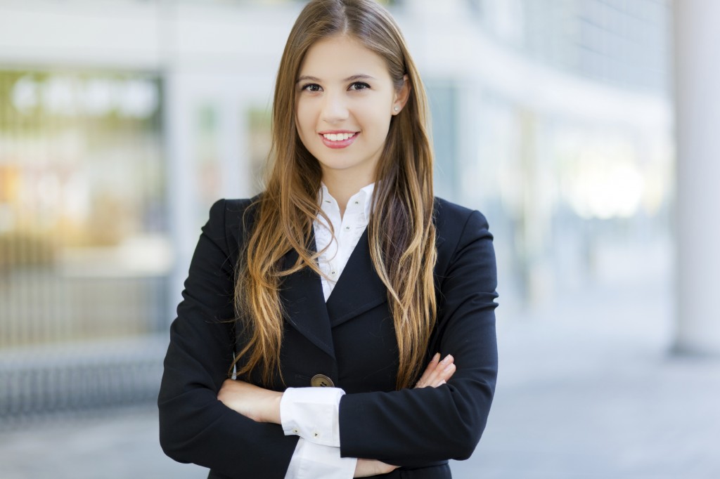 Smiling businesswoman in urban setting