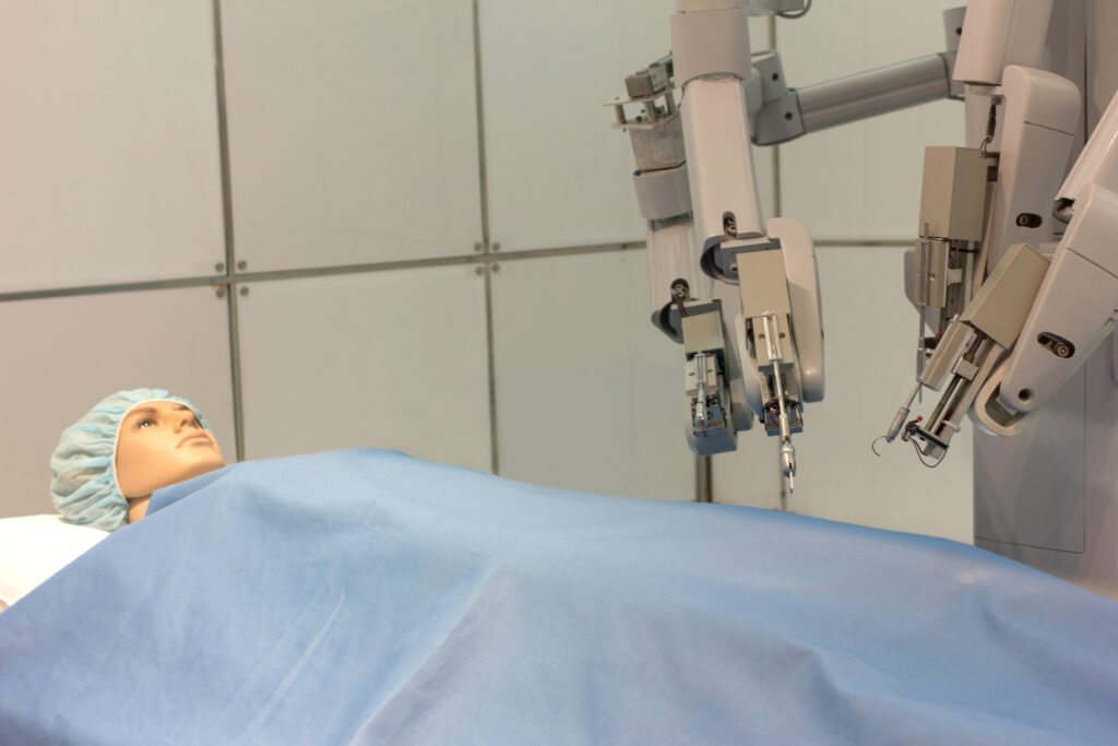 a surgical robot undertaking a test on a plastic doll patient